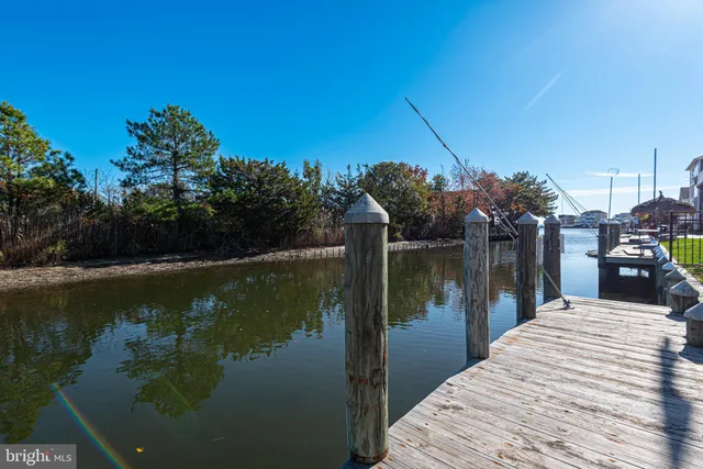 a lake view with a wooden bridge