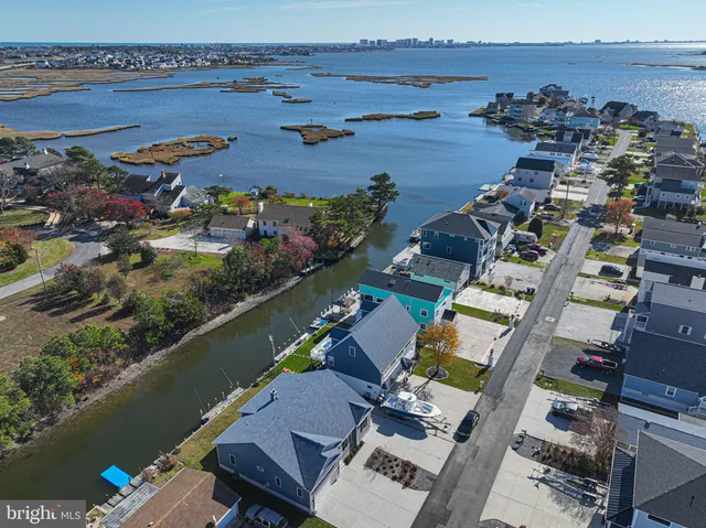 an aerial view of a house with outdoor space
