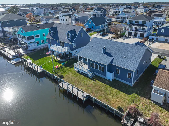 an aerial view of a house with a ocean view