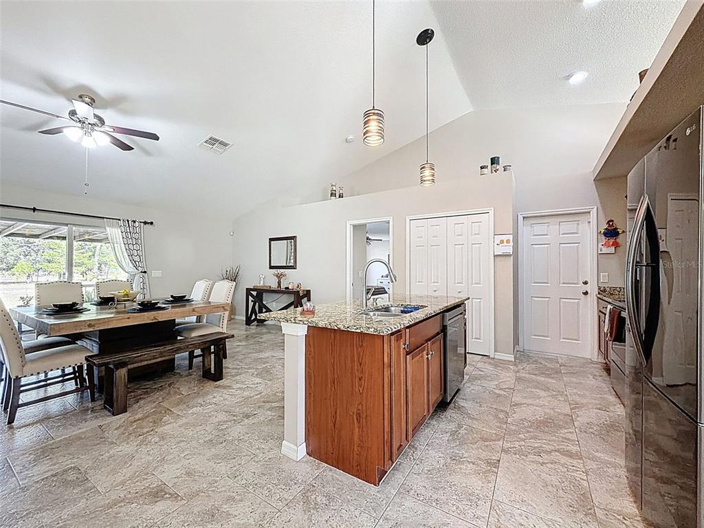 12105 Maripoe Road Weeki Wachee, FL 34614 - Photo 17 of 62 a kitchen with kitchen island granite countertop lots of counter top space
