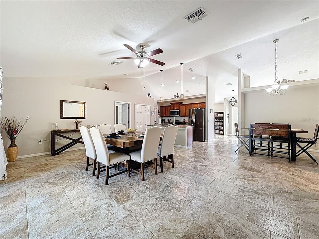 12105 Maripoe Road Weeki Wachee, FL 34614 - Photo 21 of 62 a view of a dining room with furniture