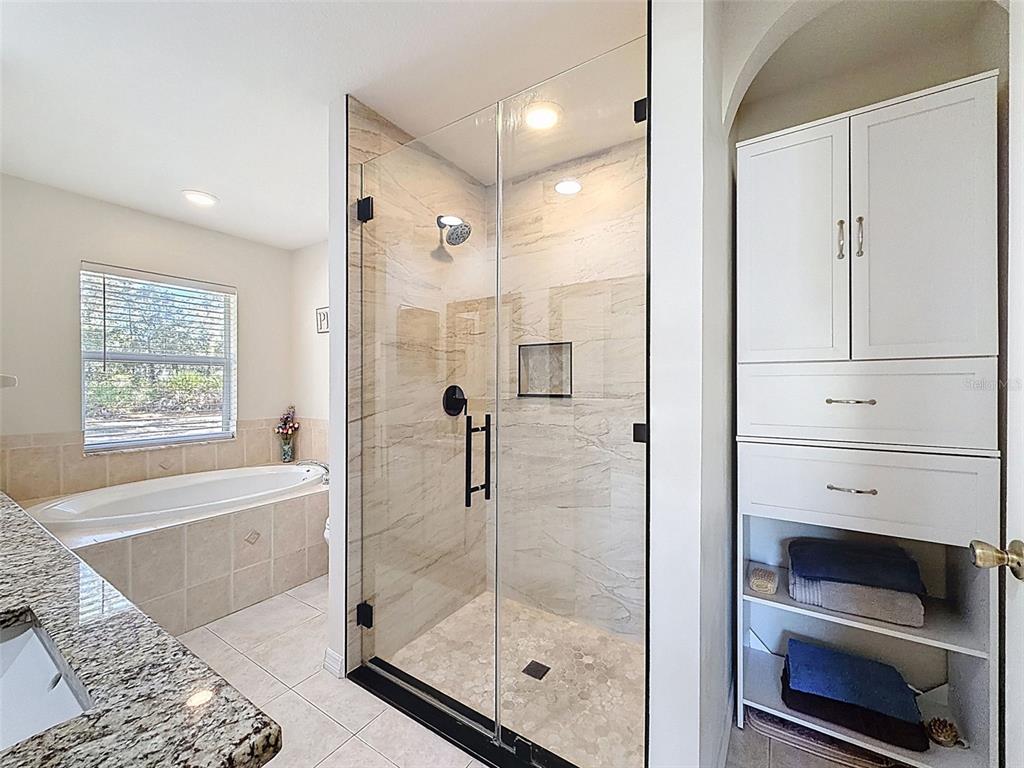 12105 Maripoe Road Weeki Wachee, FL 34614 - Photo 35 of 62 a bathroom with a shower and a sink
