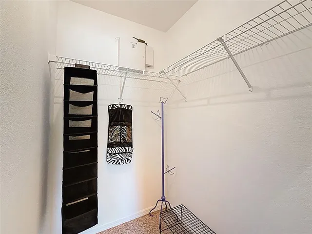a living room with furniture and floor to ceiling windows