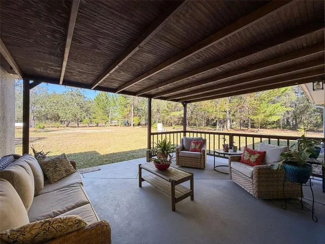 an aerial view of residential houses with outdoor space and street view