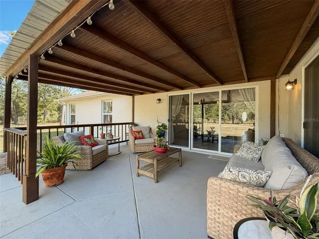 an aerial view of a house with a yard and garden