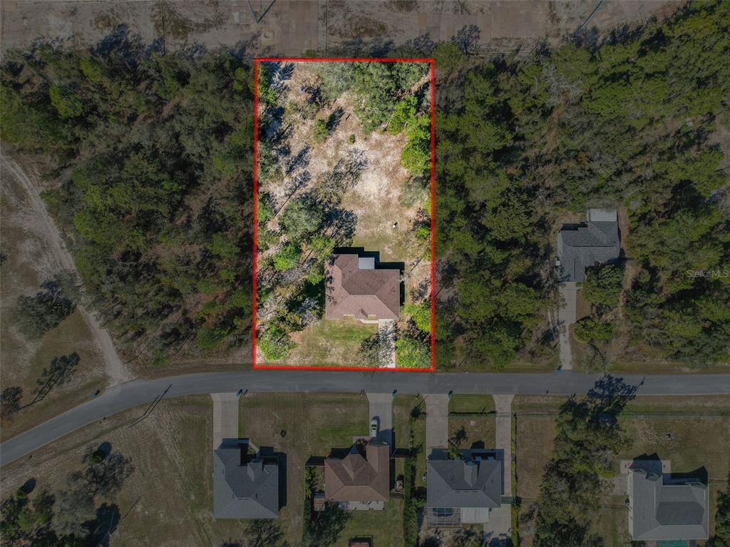 12105 Maripoe Road Weeki Wachee, FL 34614 - Photo 5 of 62 an aerial view of a residential houses with outdoor space