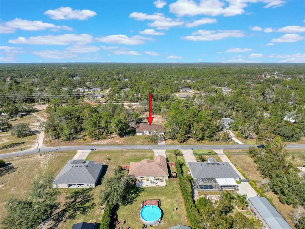 12105 Maripoe Road Weeki Wachee, FL 34614 - Photo 58 of 62 an aerial view of residential houses with outdoor space and street view