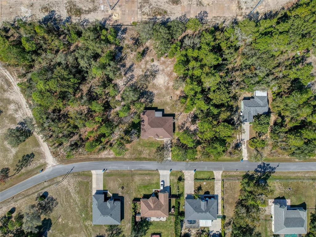 12105 Maripoe Road Weeki Wachee, FL 34614 - Photo 6 of 62 an aerial view of a house with a yard