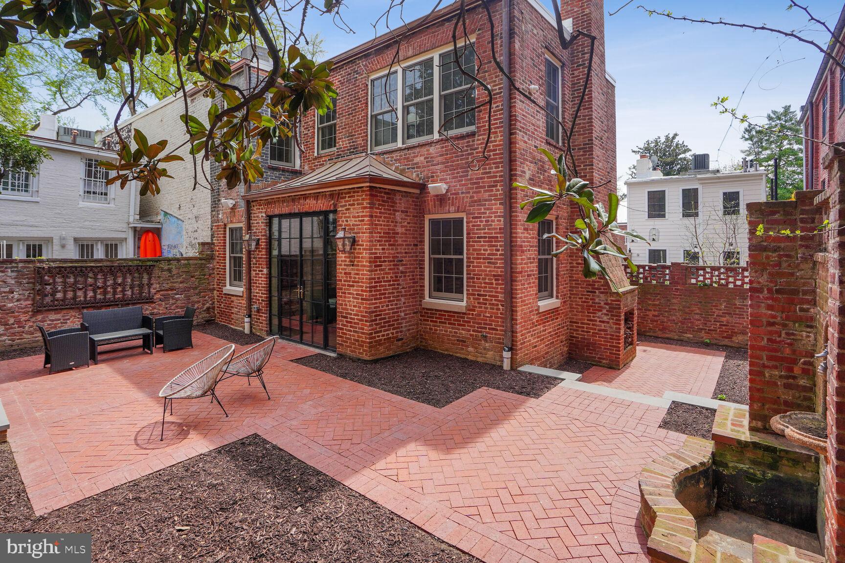 1306 27th Street Northwest Washington, DC 20007 - Photo 32 of 36 Terrace wraps around rear of house - outdoor fplc.