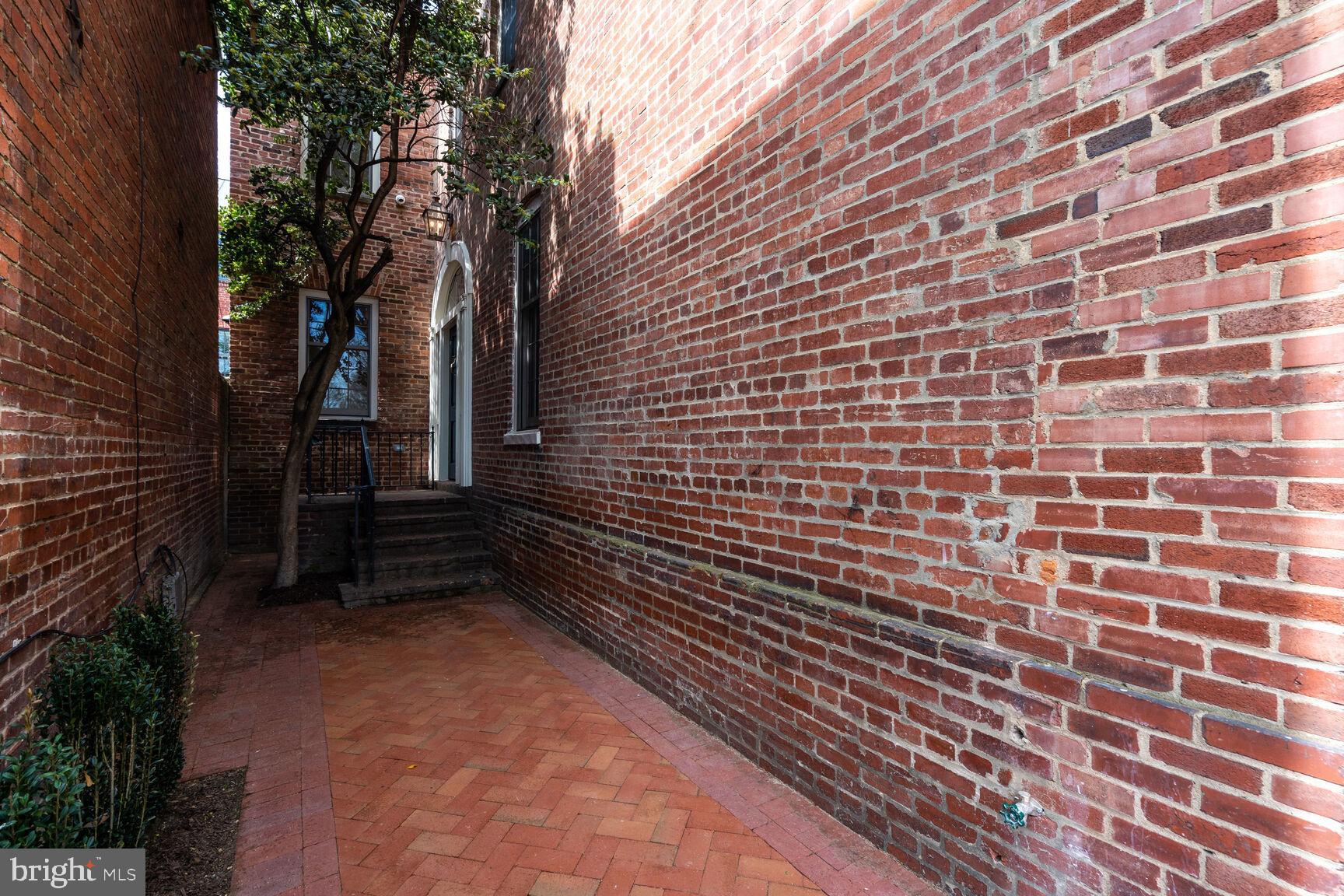 1306 27th Street Northwest Washington, DC 20007 - Photo 33 of 36 Front entry with small parking space