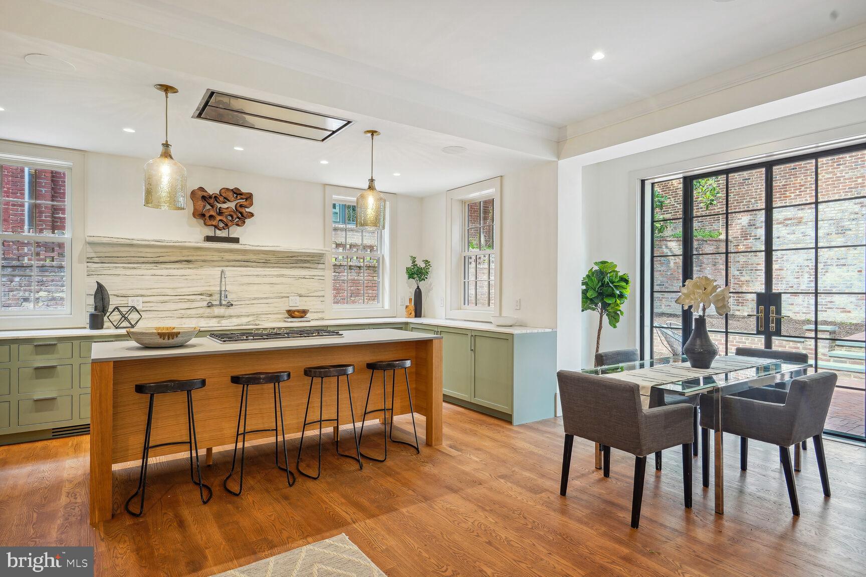 1306 27th Street Northwest Washington, DC 20007 - Photo 7 of 36 Kitchen with pull up bar seating and dining area
