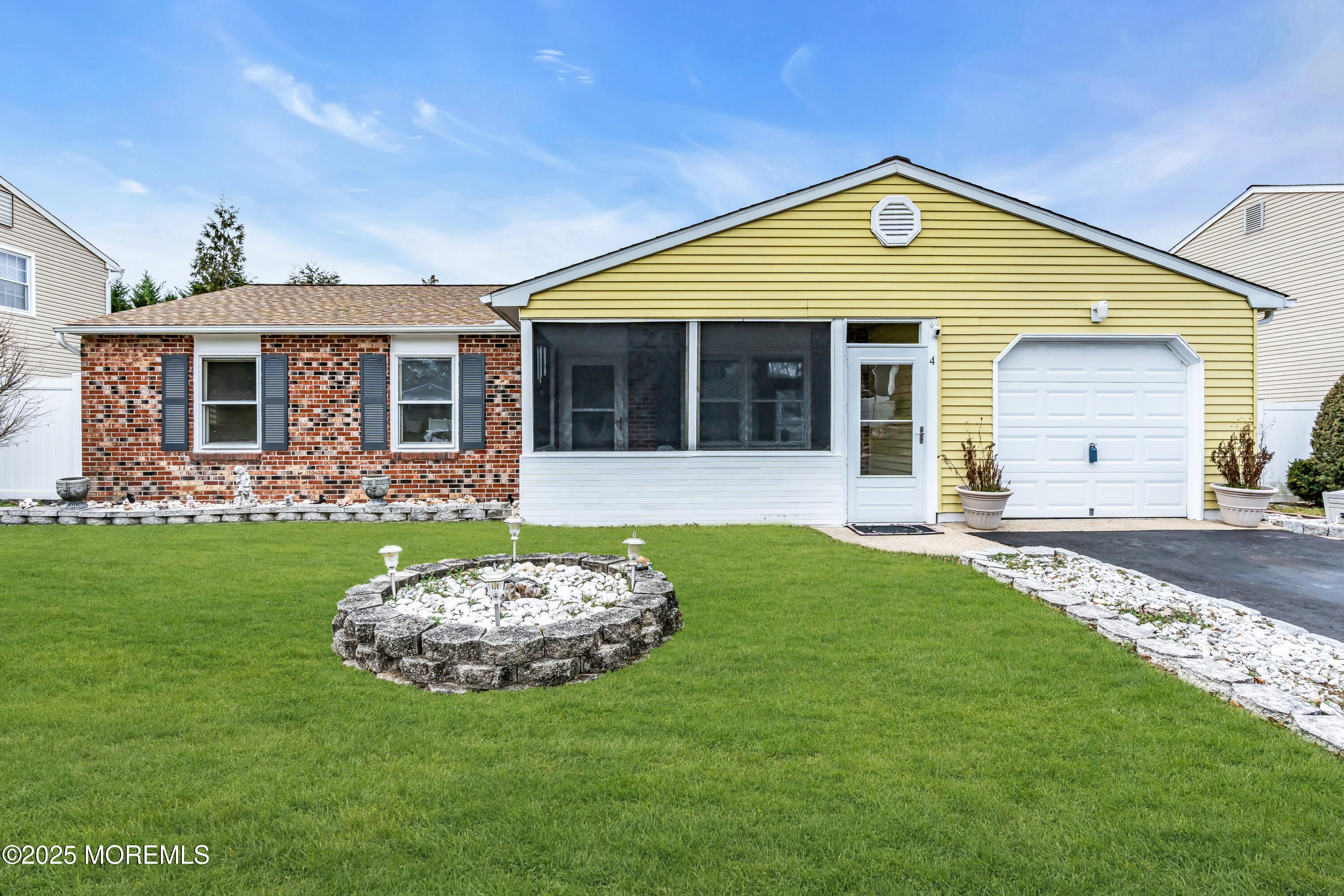 4 Evergreen Place Howell, NJ 07731 - Photo 1 of 27 a front view of a house with a yard