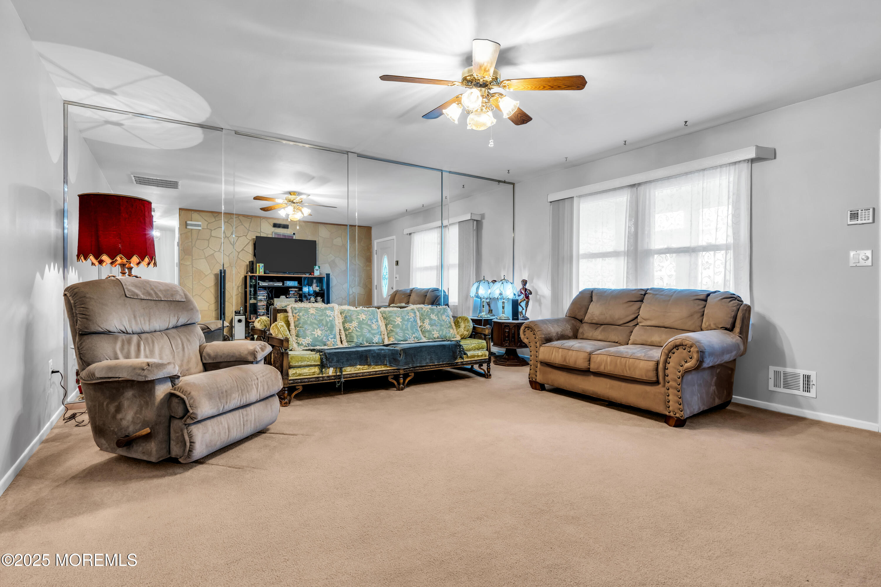 4 Evergreen Place Howell, NJ 07731 - Photo 5 of 27 a living room with furniture and a chandelier