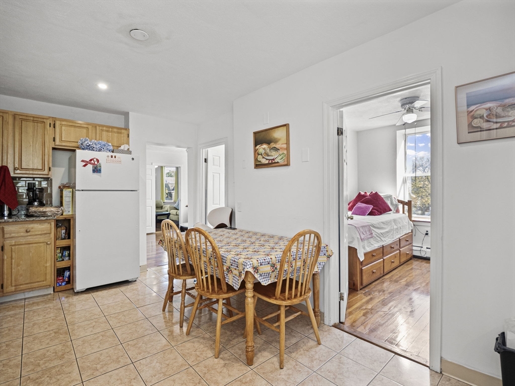 95 Florida Street, Unit 2 Boston, MA 02124 - Photo 11 of 29 a dining room with furniture and a kitchen view