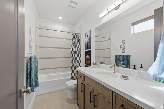2559 West Aurora Avenue Mapleton, UT 84664 - Photo 32 of 60 Bathroom featuring a wood-finish double vanity with a light-toned countertop, integrated sinks, and brushed nickel faucets