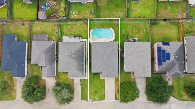 an aerial view of a house with a lake view