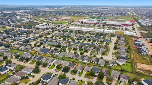 an aerial view of residential building with parking space