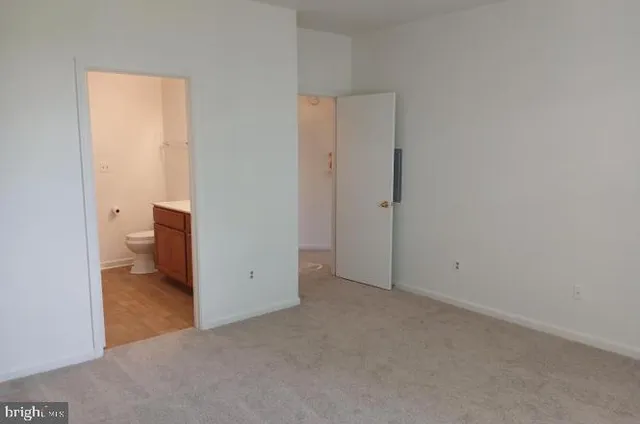 an empty room and a toilet