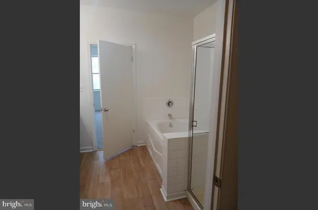 a view of a bathroom from a hallway