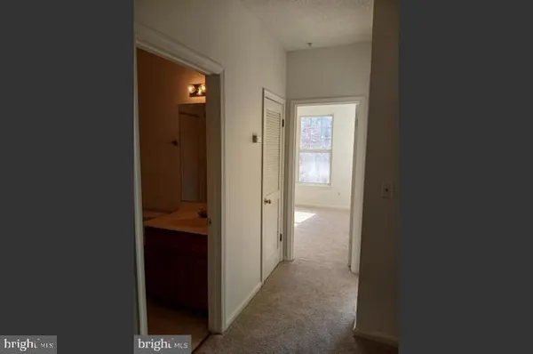 a view of a bathroom from a hallway