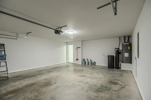 an empty room with closet and a ceiling fan