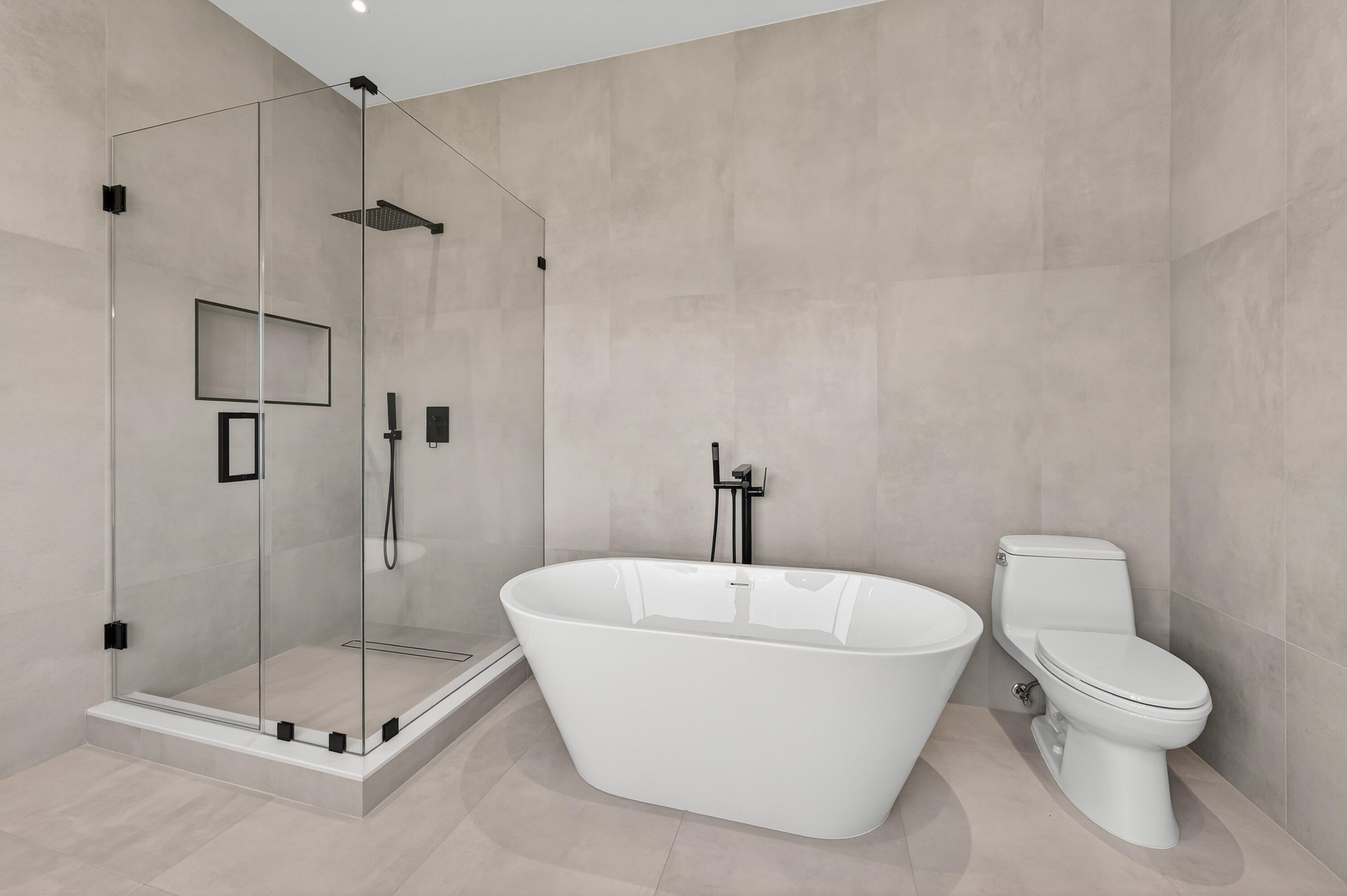 13613 157th Court North Jupiter, FL 33478 - Photo 18 of 54 a bathroom with a toilet and a shower