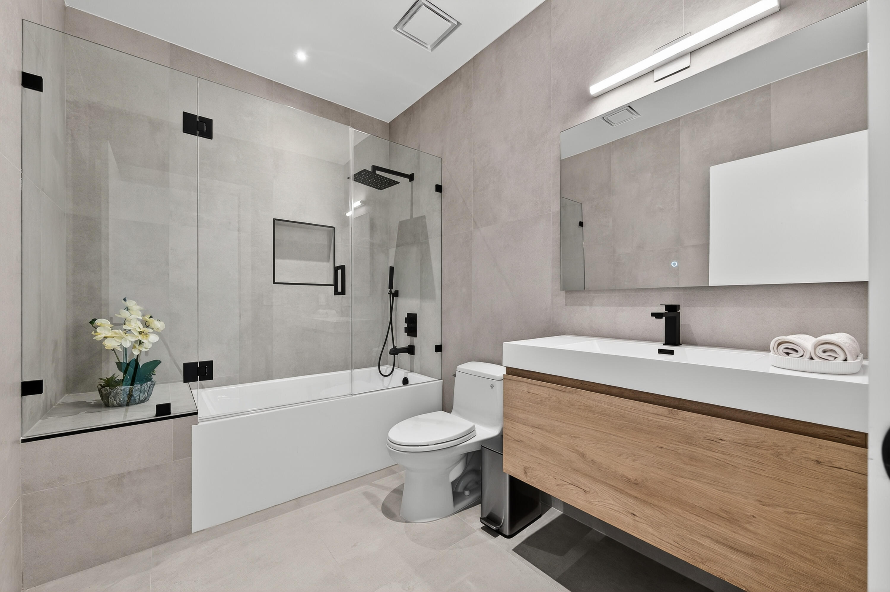 13613 157th Court North Jupiter, FL 33478 - Photo 24 of 54 a spacious bathroom with a bathtub shower sink mirror and toilet