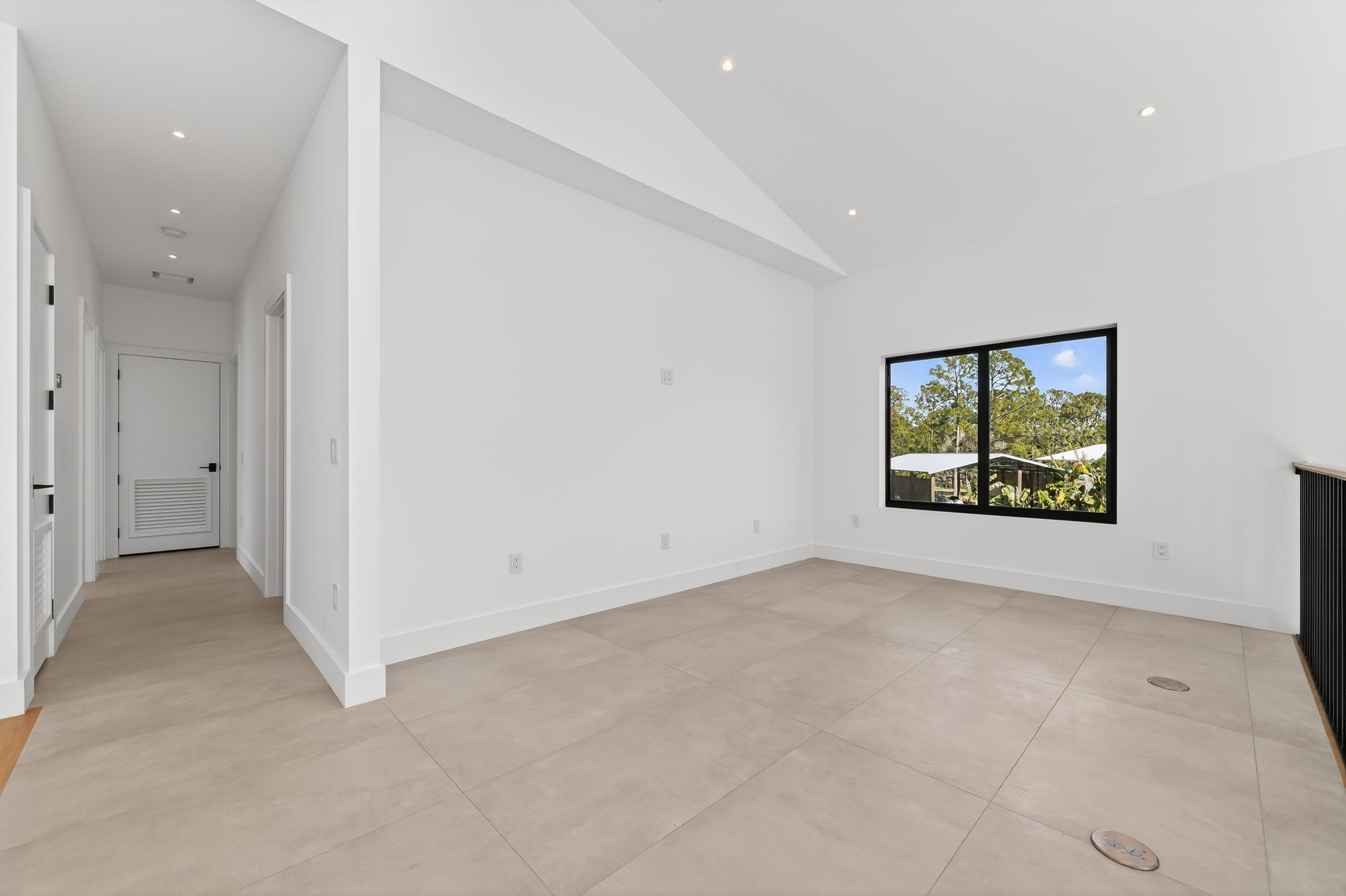 13613 157th Court North Jupiter, FL 33478 - Photo 25 of 54 an empty room with windows