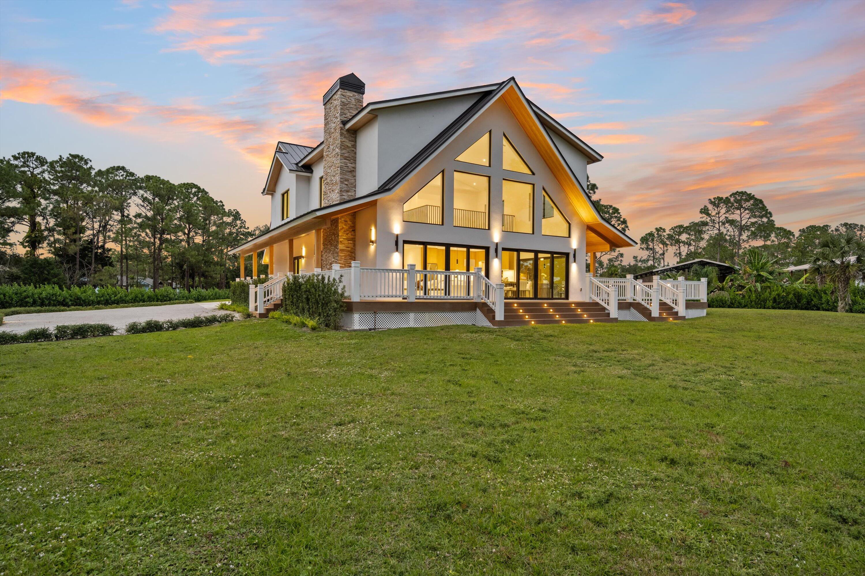 13613 157th Court North Jupiter, FL 33478 - Photo 30 of 54 a view of an house with a big yard