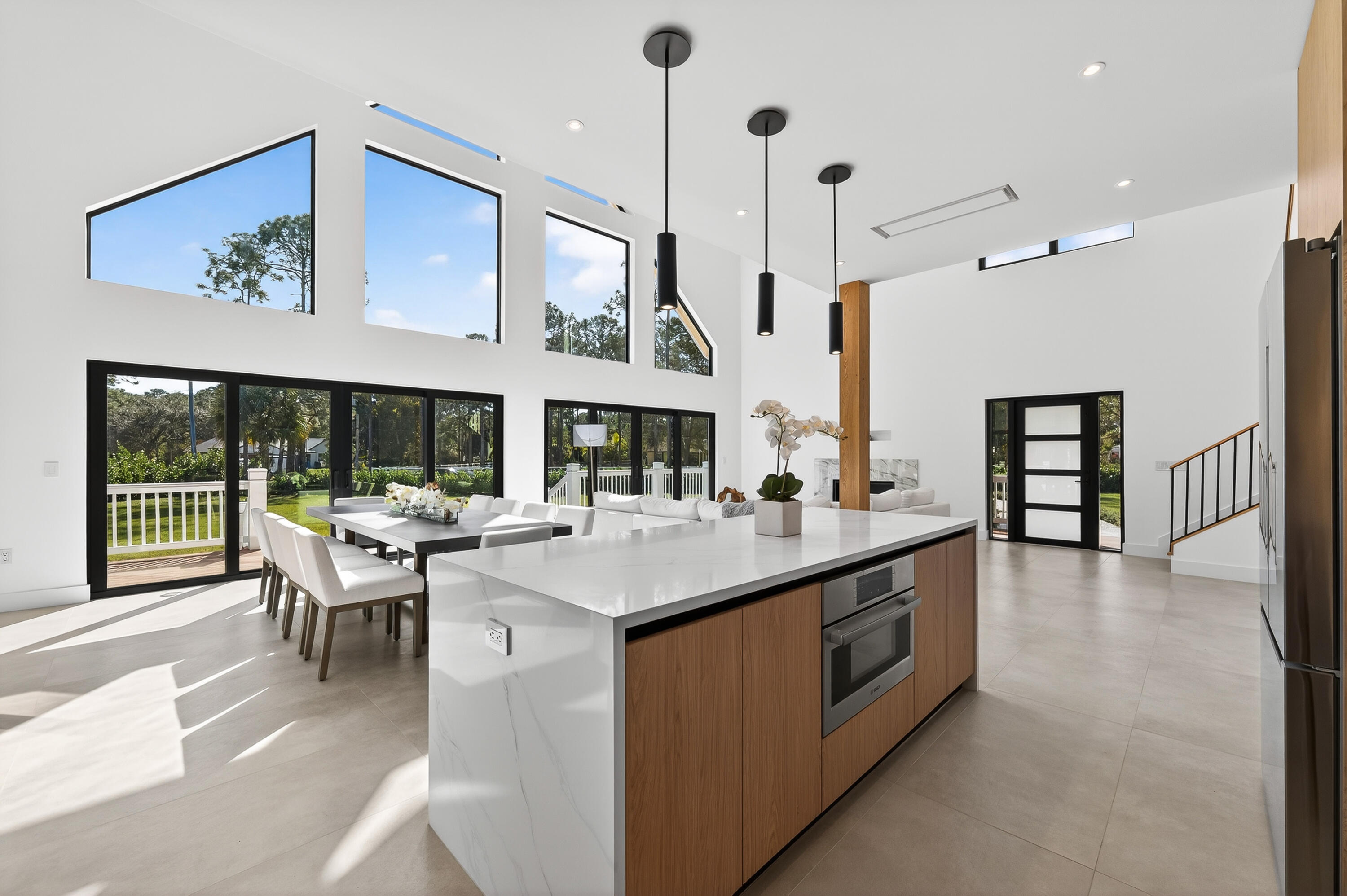 13613 157th Court North Jupiter, FL 33478 - Photo 3 of 54 a kitchen with a stove and a large window