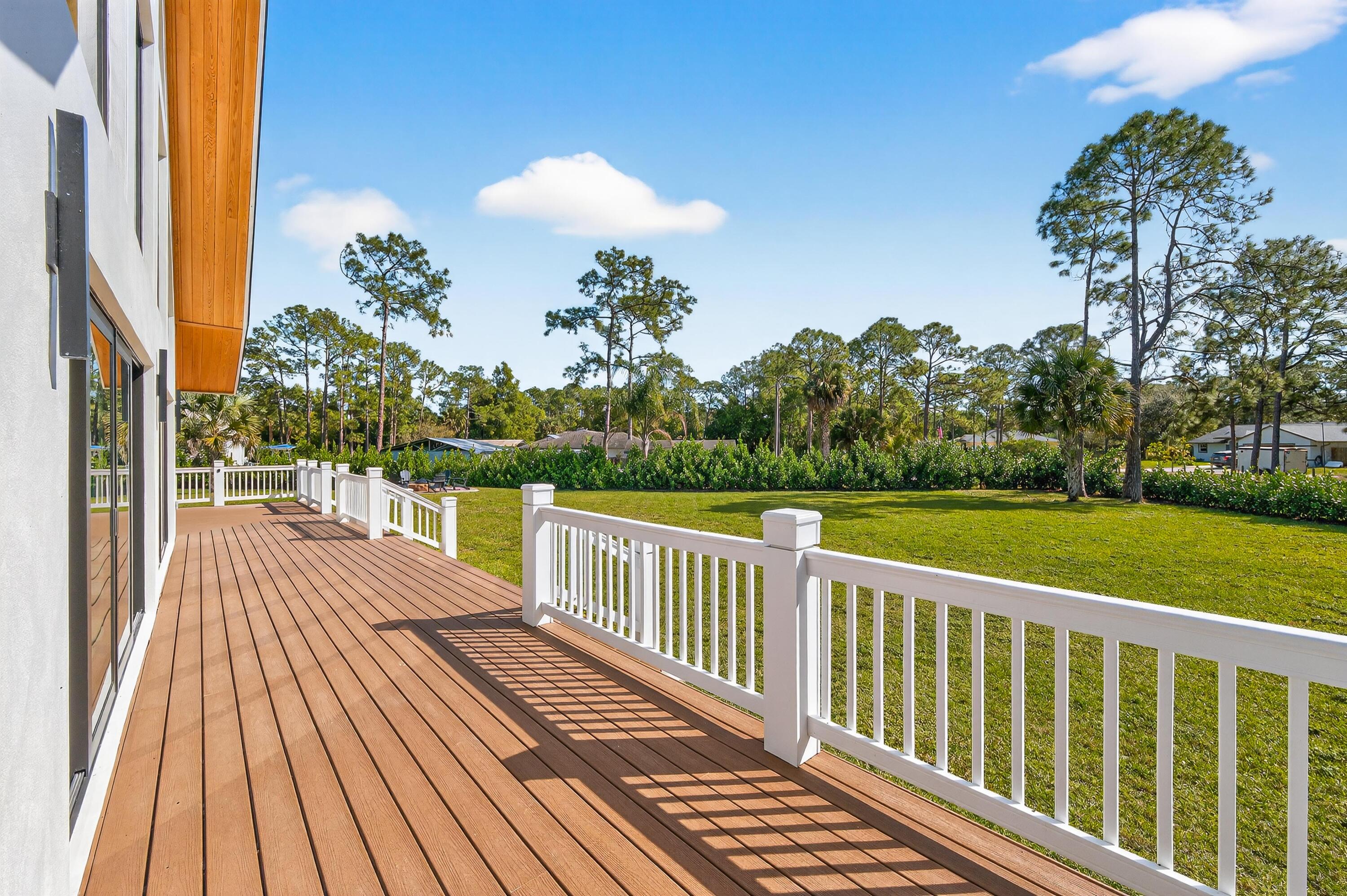 13613 157th Court North Jupiter, FL 33478 - Photo 32 of 54 a view of a balcony with wooden floor