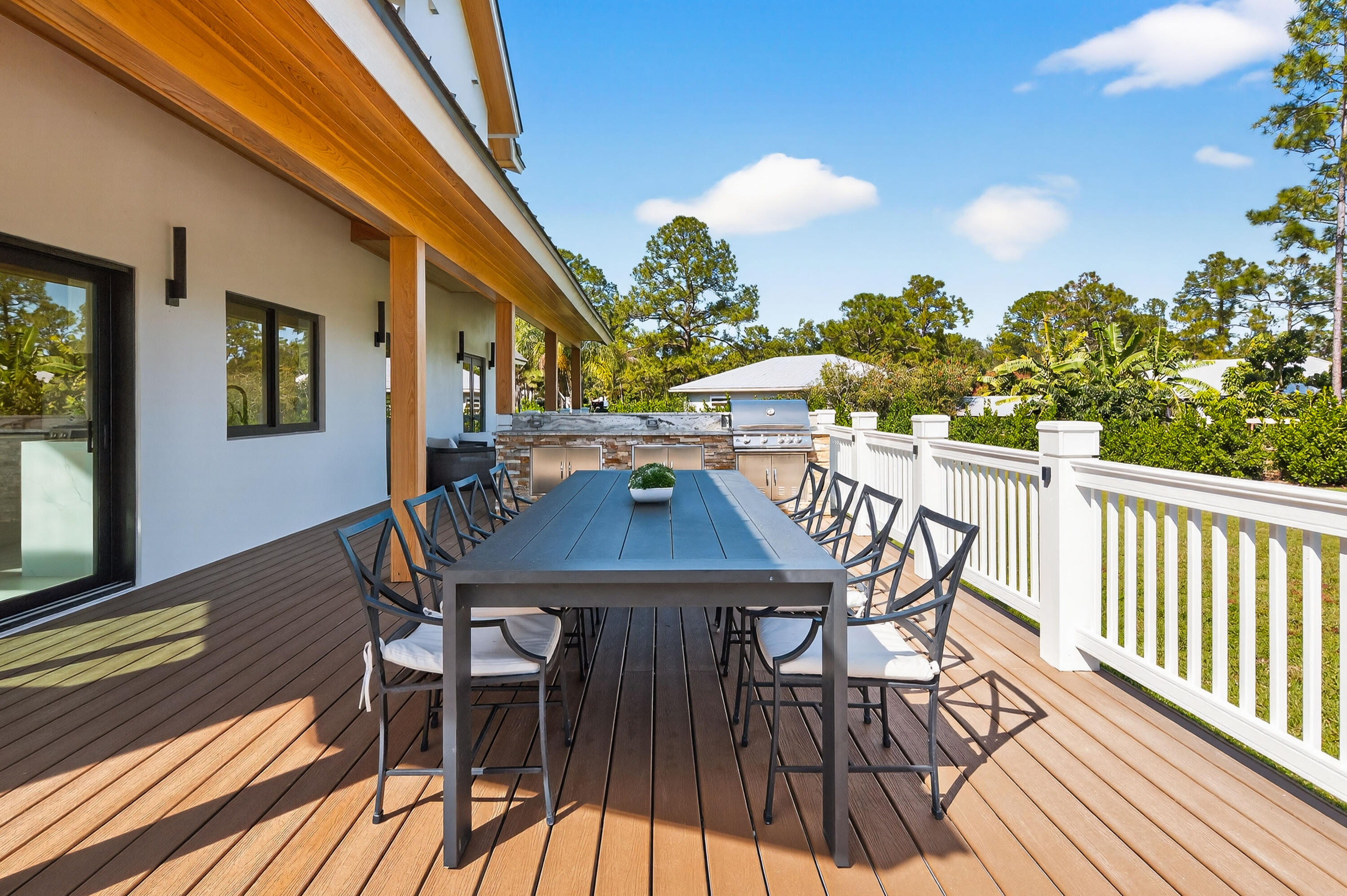 13613 157th Court North Jupiter, FL 33478 - Photo 33 of 54 a view of a dining tables and chairs on the roof deck