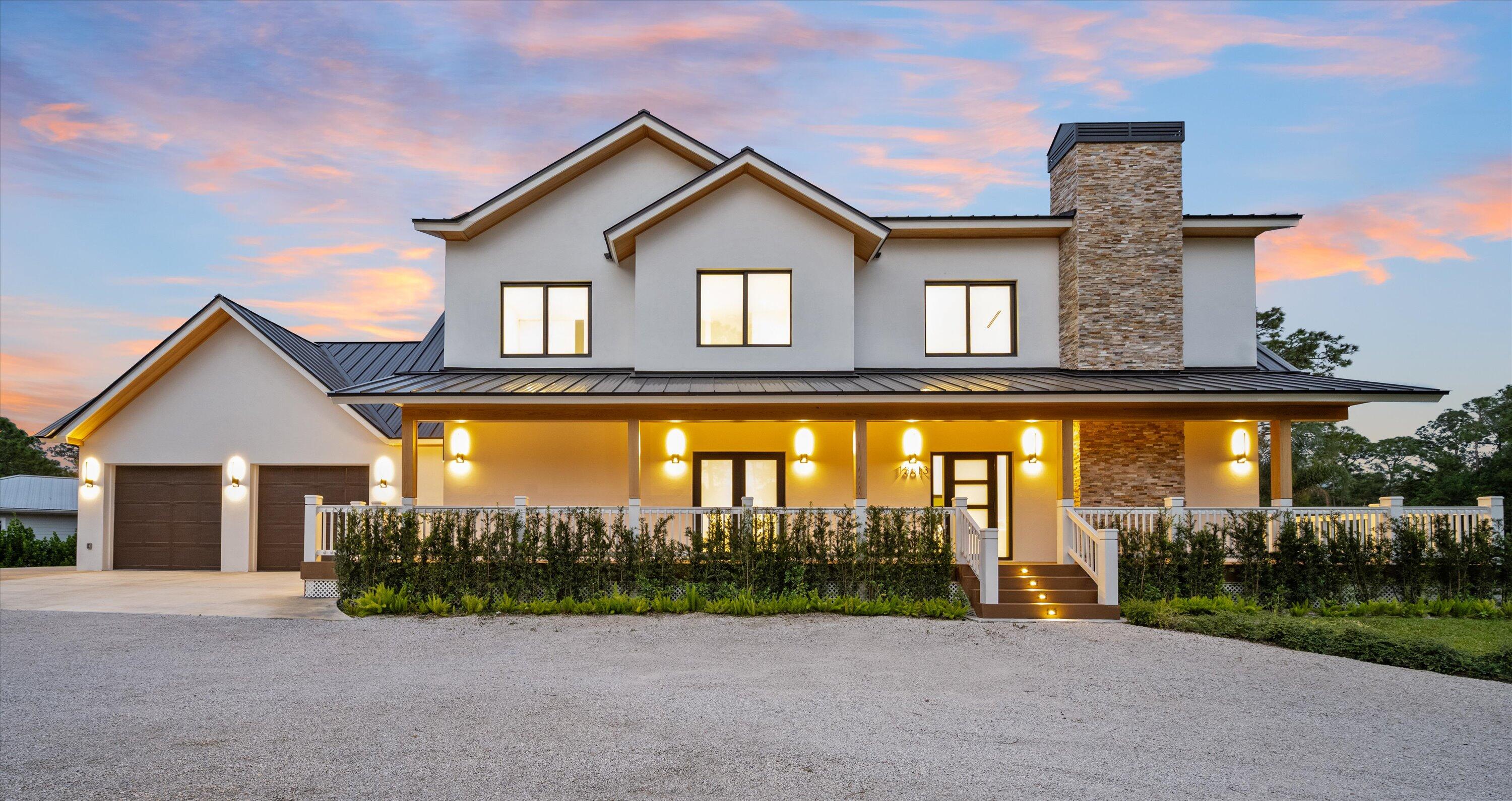 13613 157th Court North Jupiter, FL 33478 - Photo 48 of 54 a view of a house with a swimming pool and a yard