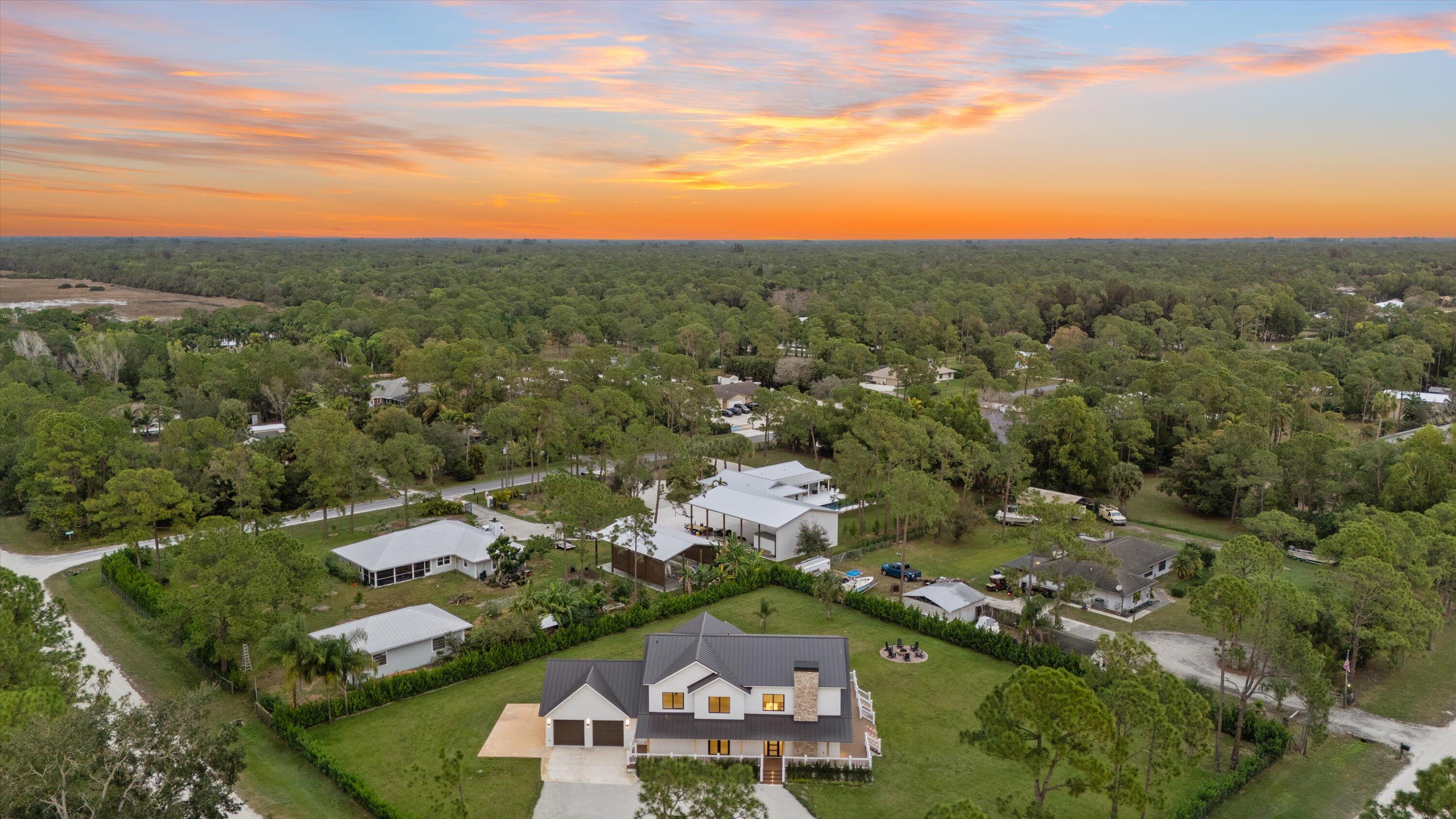 13613 157th Court North Jupiter, FL 33478 - Photo 50 of 54 an aerial view of residential houses with outdoor space