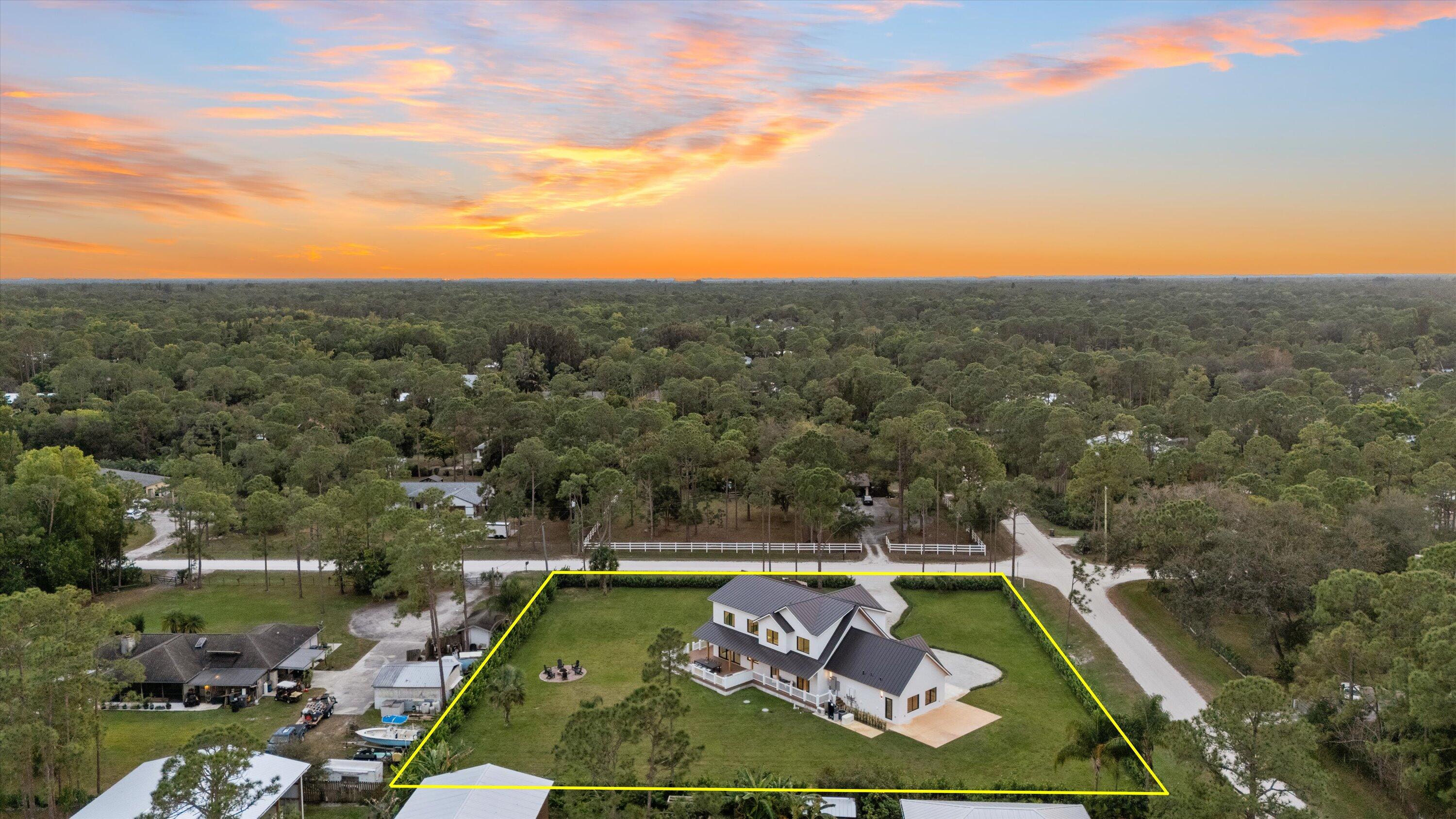 13613 157th Court North Jupiter, FL 33478 - Photo 53 of 54 a view of a tennis court