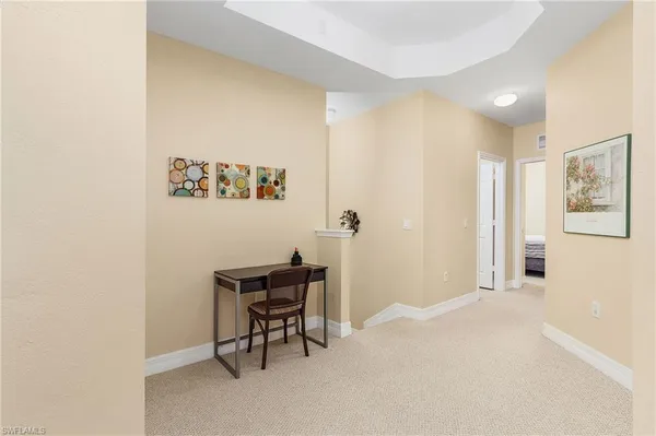 a view of a hallway with workspace