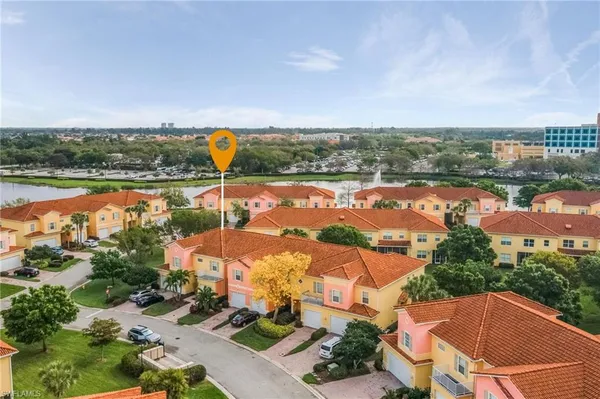 an aerial view of houses with yard