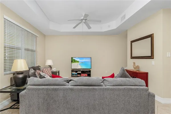a living room with furniture and a window