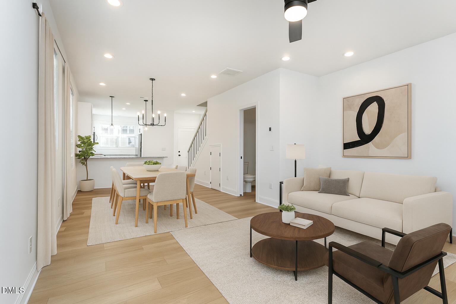 4801 Gossamer Lane, Unit 106 Raleigh, NC 27616 - Photo 11 of 42 a living room with furniture and kitchen view