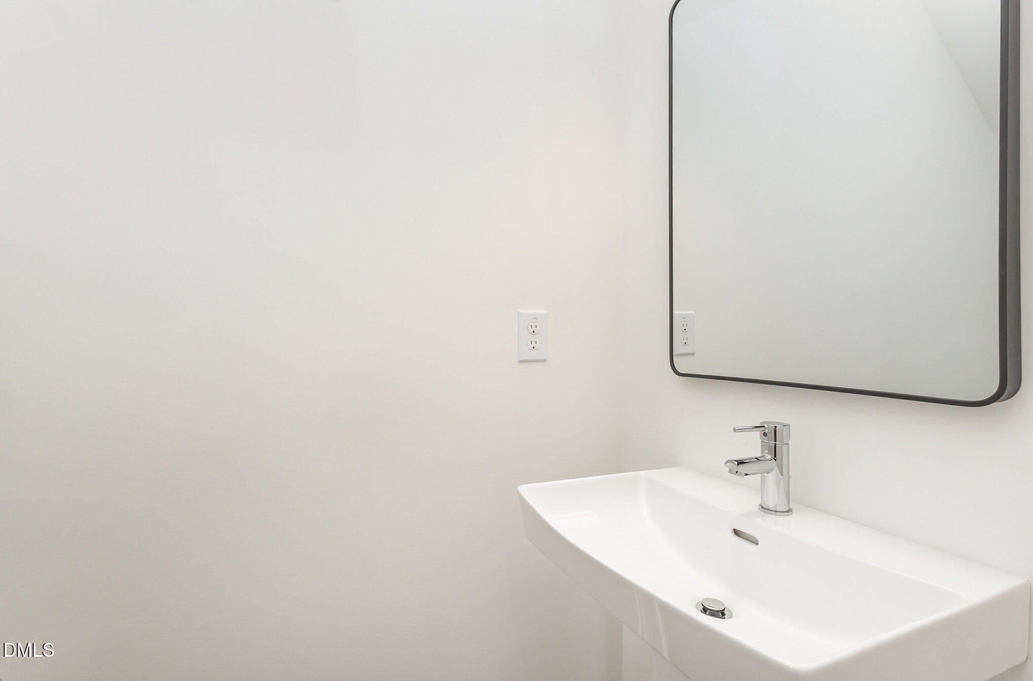 4801 Gossamer Lane, Unit 106 Raleigh, NC 27616 - Photo 15 of 42 a bathroom with a sink and a mirror