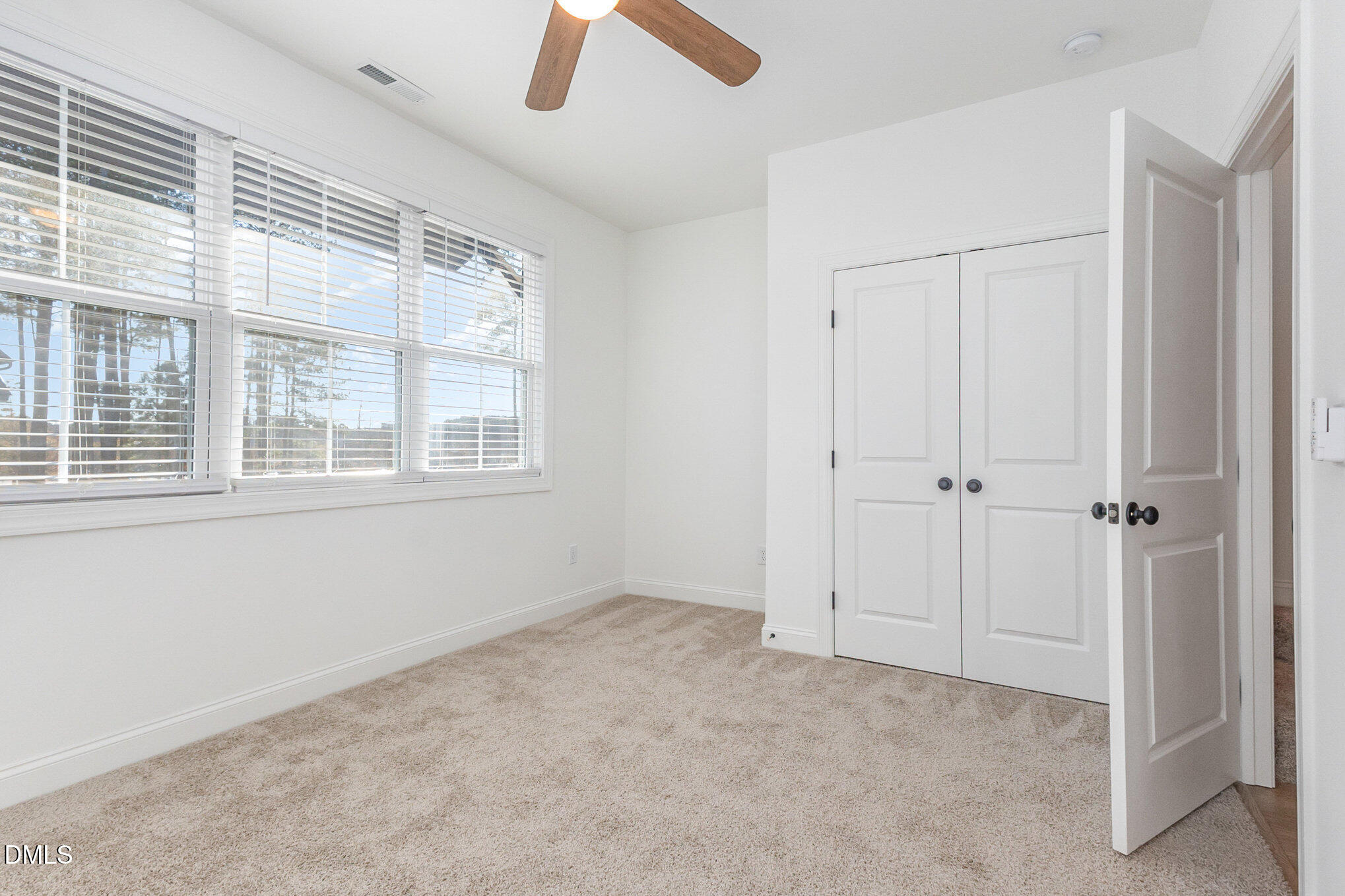 4801 Gossamer Lane, Unit 106 Raleigh, NC 27616 - Photo 21 of 42 a view of an empty room with a window