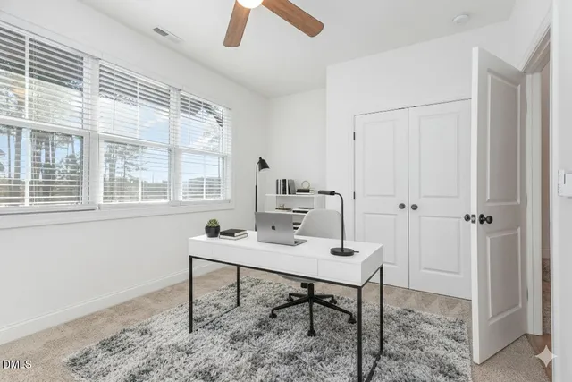 a bathroom with a granite countertop sink a mirror and shower