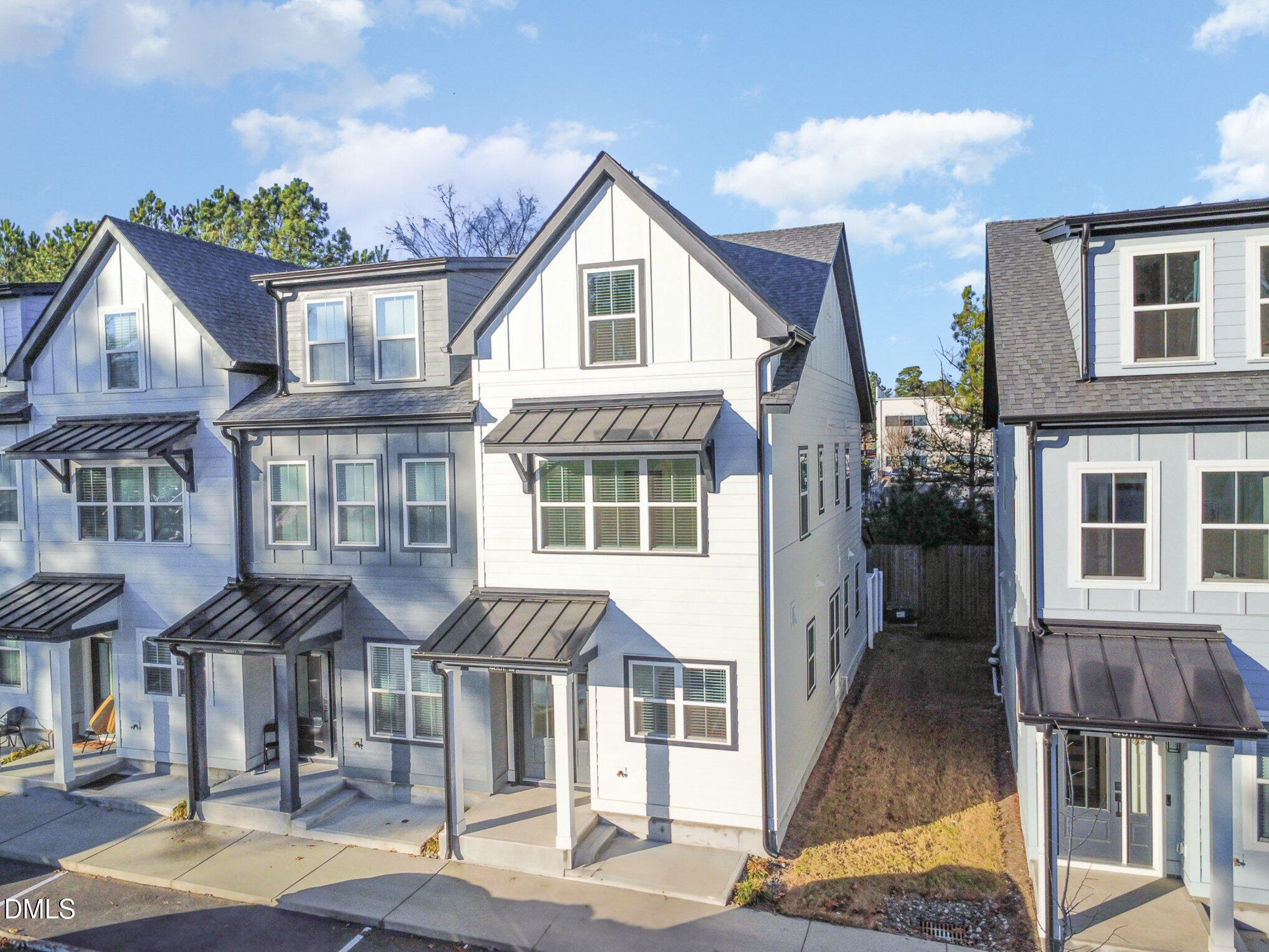 4801 Gossamer Lane, Unit 106 Raleigh, NC 27616 - Photo 2 of 42 a front view of a residential apartment building with a yard