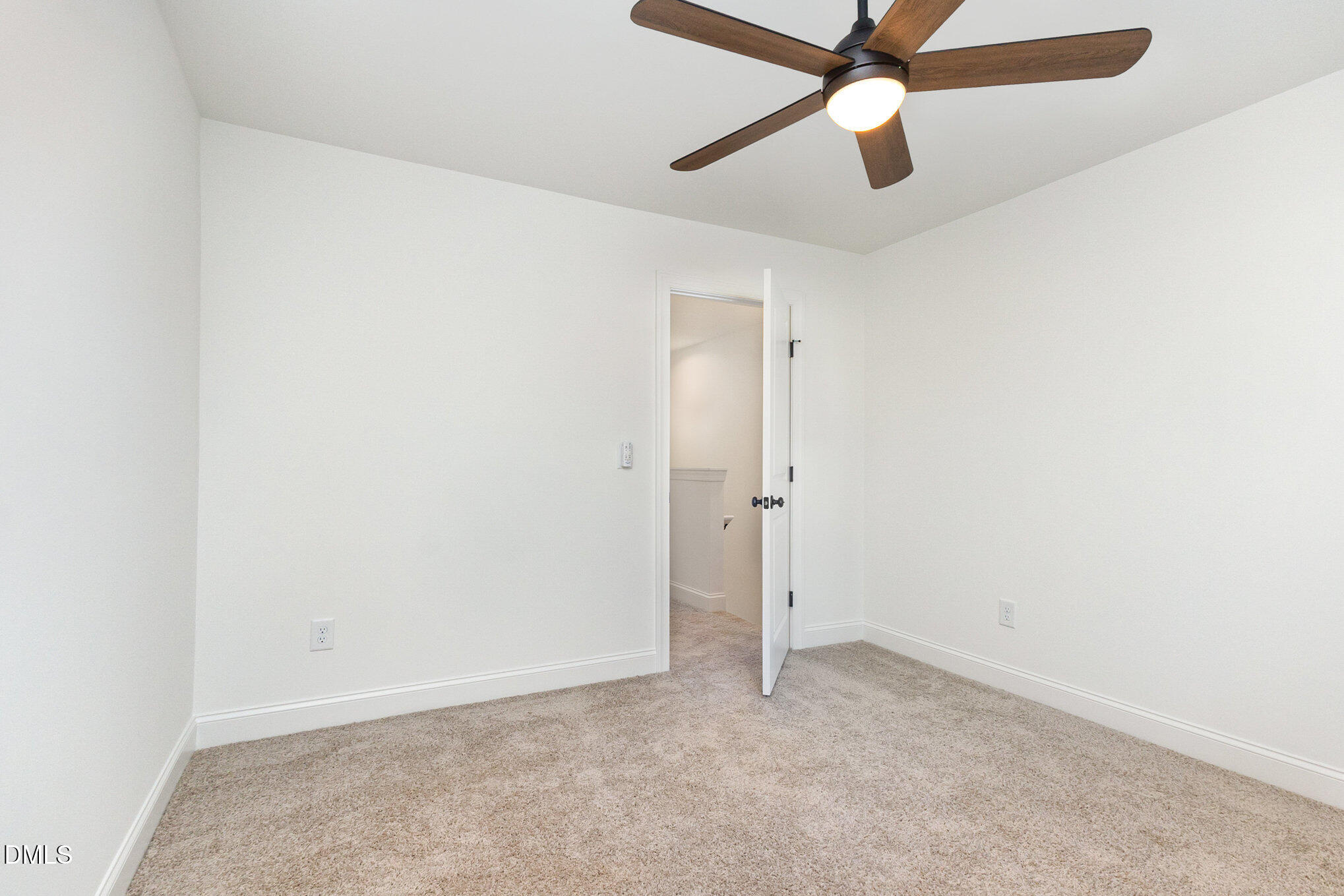 4801 Gossamer Lane, Unit 106 Raleigh, NC 27616 - Photo 30 of 42 an empty room with ceiling fan and window