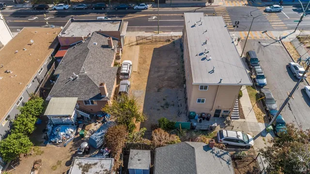 an aerial view of a house with a yard and plants