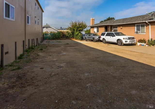 a view of street with parked cars