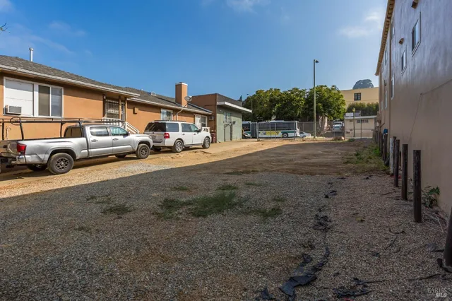 a view of street with parked cars