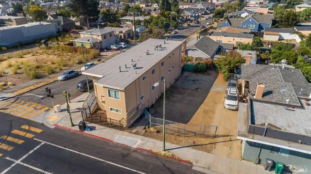 an aerial view of residential houses with outdoor space