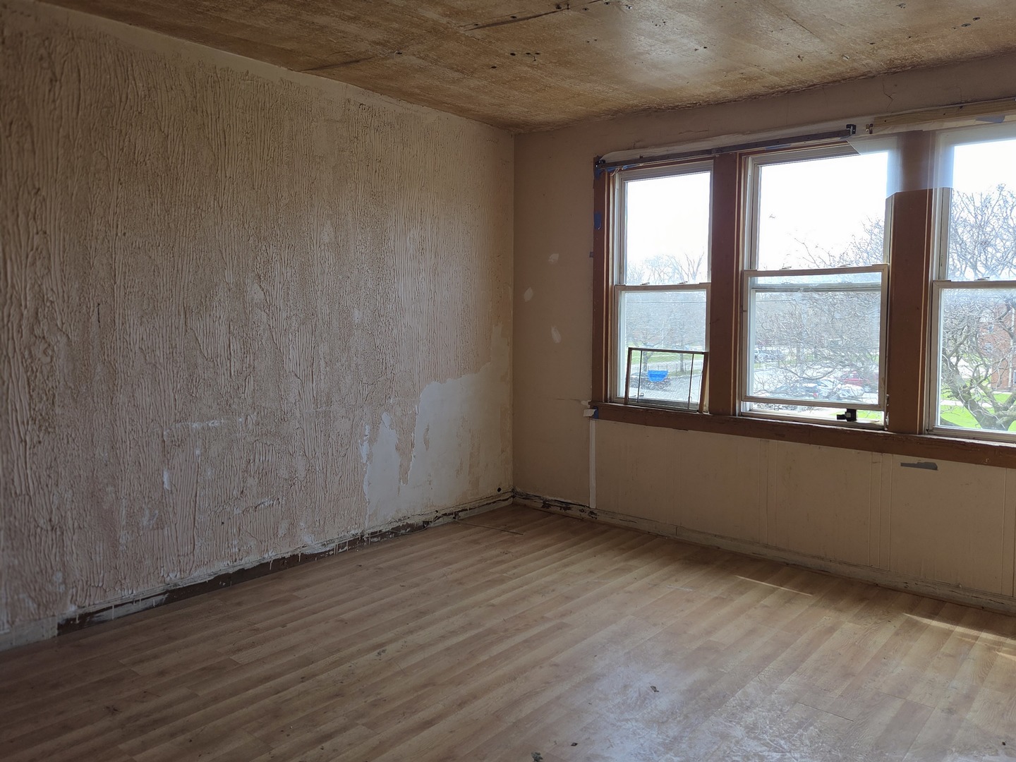 8847 South Burley Avenue Chicago, IL 60617 - Photo 24 of 29 an empty room with wooden floor and windows