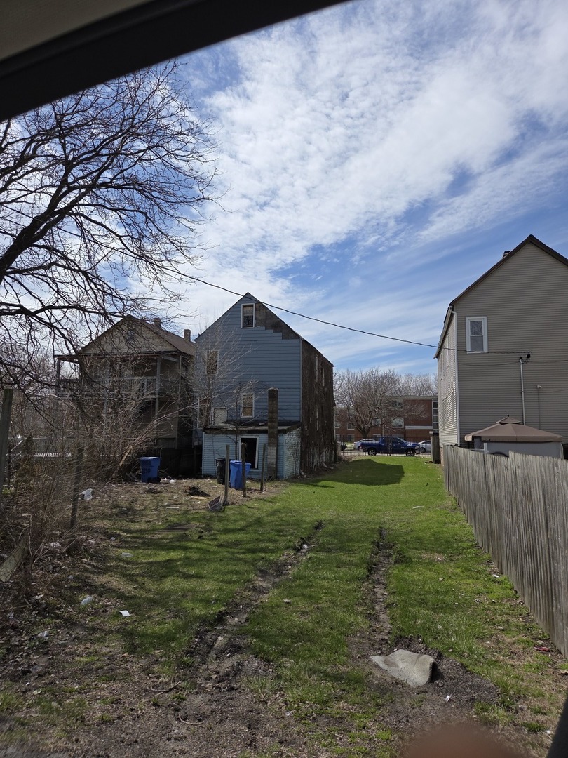 8847 South Burley Avenue Chicago, IL 60617 - Photo 29 of 29 a view of a house with a yard